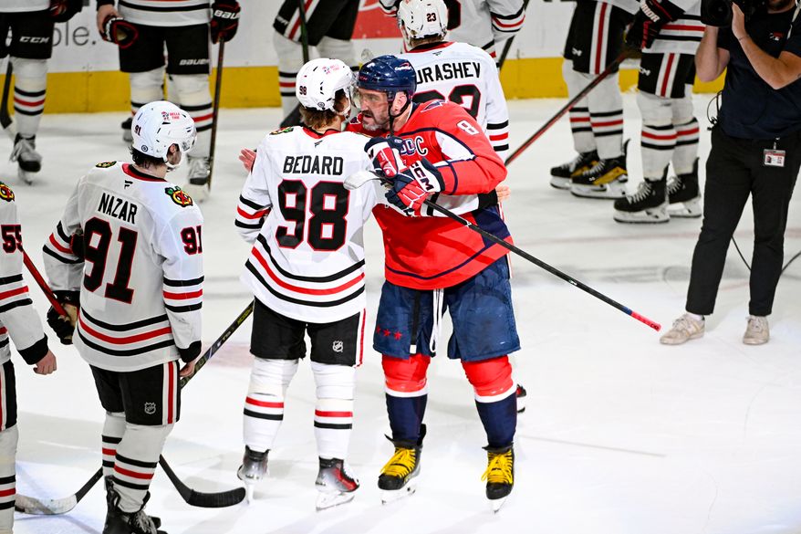 Washington Capitals left wing Alex Ovechkin (8) greeting Chicago Blackhawks center Connor Bedard (98) after the team’s 5-3 win over the Blackhawks at Capital One Arena in Washington D.C., April 4, 2025. Ovechkin scored goal number 894 in the win. (Photo for the Washington Times)