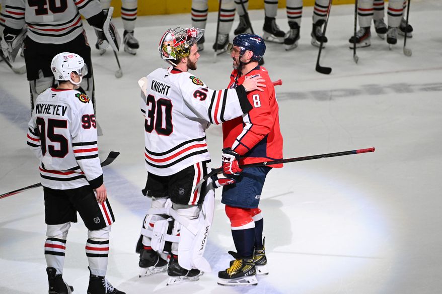 Washington Capitals left wing Alex Ovechkin (8) having a word with Chicago Blackhawks goalie Spencer Knight (30) after the team’s 5-3 win over the Blackhawks at Capital One Arena in Washington D.C., April 4, 2025. Ovechkin scored goal number 894 in the win. (Photo for the Washington Times)