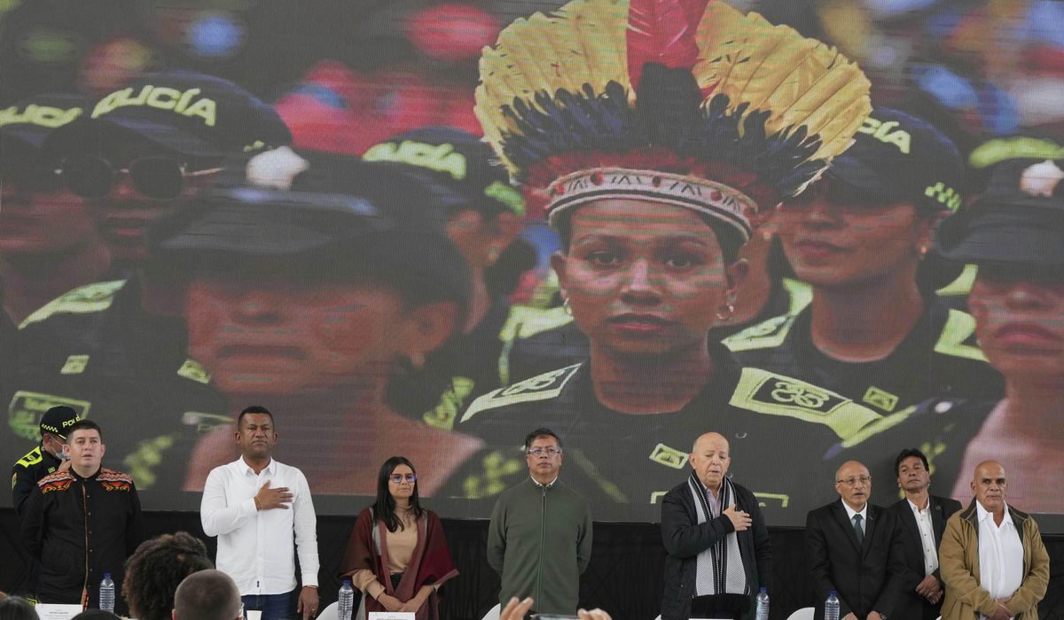 NextImg:A rebel group begins handing weapons over to the Colombian government as peace talks advance