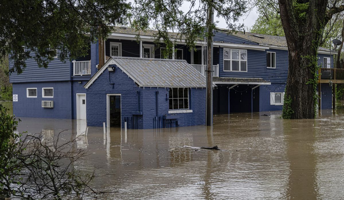 NextImg:Rising rivers and flash floods threaten waterlogged U.S. communities