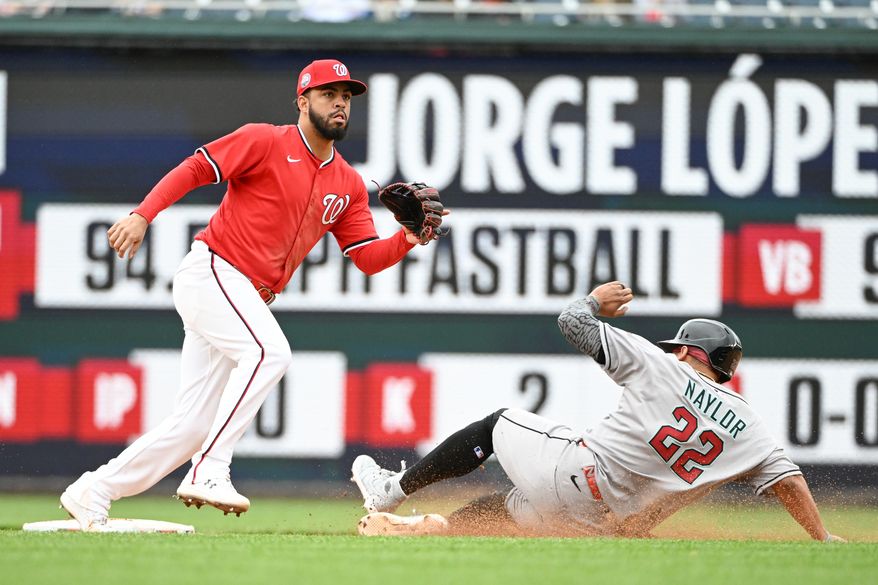 Arizona Diamondbacks first baseman Josh Naylor (22) sliding into second base with a steal as Washington Nationals second baseman Luis Garcia (2) awaits the throw of an MLB game at Nationals Park in Washington D.C., April 6, 2025. (Photo by All-Pro Reels for Washington Times Sports)