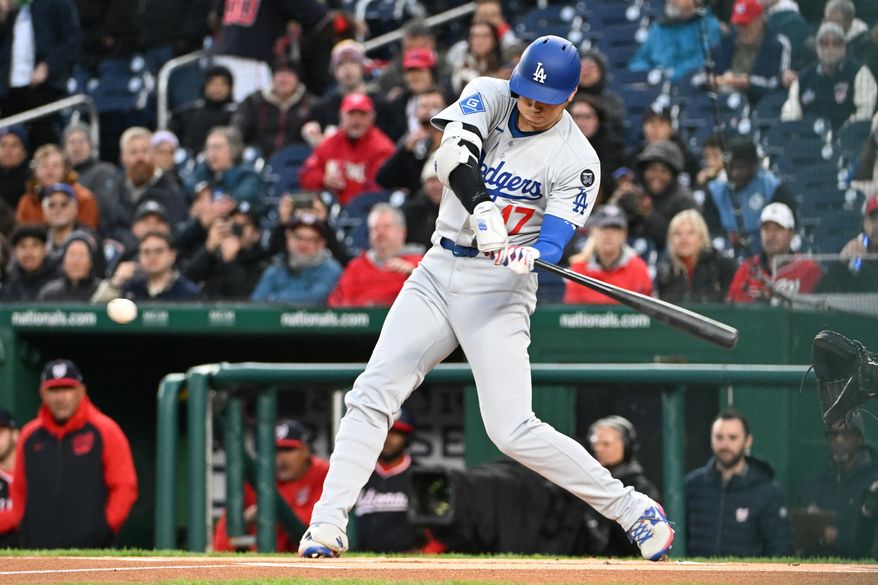 Los Angeles Dodgers designated hitter Shohei Ohtani (17) hitting a single during the first inning of an MLB game against the Washington Nationals at Nationals Park in Washington D.C., April 7, 2025. (Photo by All-Pro Reels for Washington Times Sports)