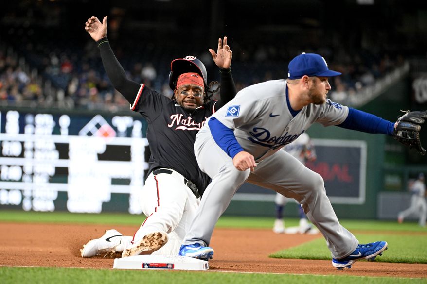Washington Nationals designated hitter Josh Bell (19) sliding into third base during the second inning of an MLB game against the Los Angeles Dodgers at Nationals Park in Washington D.C., April 7, 2025. (Photo by All-Pro Reels for Washington Times Sports)