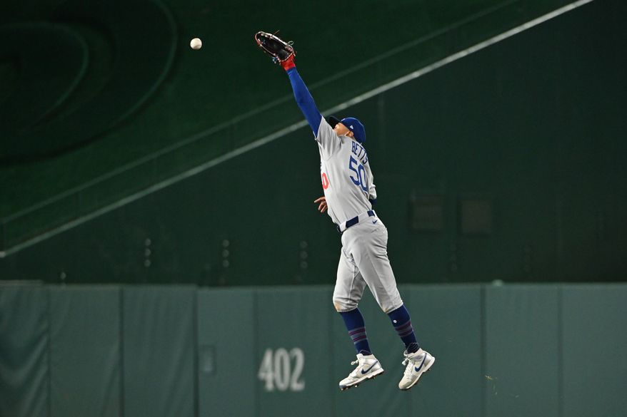Los Angeles Dodgers shortstop Mookie Betts (50) leaping for a ball during the seventh inning of an MLB game against the Washington Nationals at Nationals Park in Washington D.C., April 7, 2025. (Photo by All-Pro Reels for Washington Times Sports)