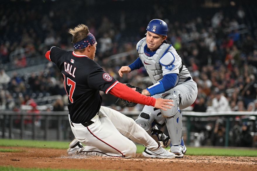Washington Nationals right fielder Alex Call (17) getting tagged out at home by Los Angeles Dodgers catcher Will Smith (16) during the seventh inning of an MLB game at Nationals Park in Washington D.C., April 7, 2025. (Photo by All-Pro Reels for Washington Times Sports)