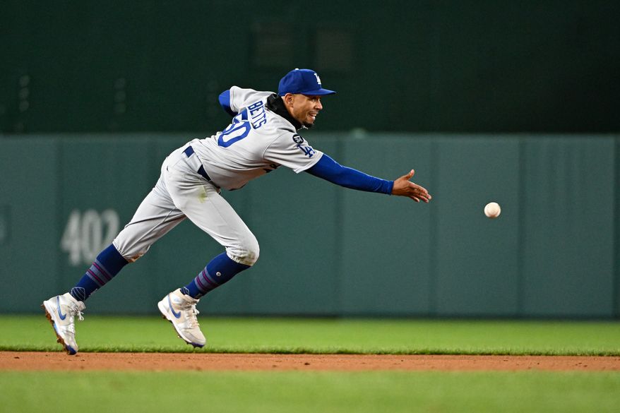 Los Angeles Dodgers shortstop Mookie Betts (50) making the toss to second base to start a double play during the eighth inning of an MLB game against the Washington Nationals at Nationals Park in Washington D.C., April 7, 2025. (Photo by All-Pro Reels for Washington Times Sports)