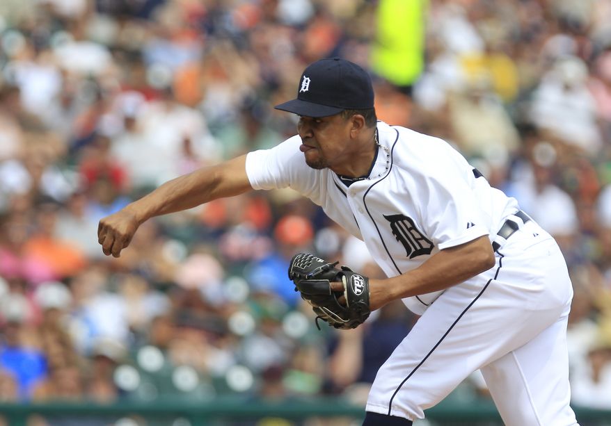 Detroit Tigers relief pitcher Octavio Dotel throws during the seventh inning of a baseball game against the Chicago White Sox in Detroit, Sunday, July 22, 2012. (AP Photo/Carlos Osorio)