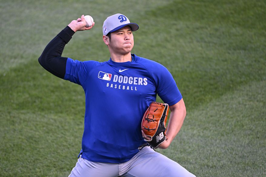 Los Angeles Dodgers designated hitter Shohei Ohtani (17) throwing pitches in the outfield before the start of an MLB game against the Washington Nationals at Nationals Park in Washington D.C., April 8, 2025. (Photo by All-Pro Reels for Washington Times Sports)