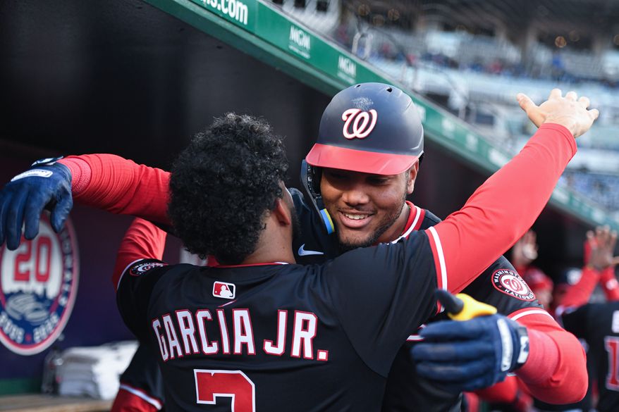 Washington Nationals designated hitter James Wood (29) hugging teammate Luis Garcia (2) after hitting a home run during the first inning of an MLB game against the Los Angeles Dodgers at Nationals Park in Washington D.C., April 8, 2025. (Photo by All-Pro Reels for Washington Times Sports)