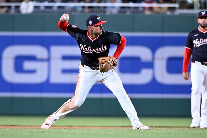 Washington Nationals shortstop Paul DeJong (14) making the throw to first after fieldig a ground ball during the sixth inning of an MLB game against the Los Angeles Dodgers at Nationals Park in Washington D.C., April 8, 2025. (Photo by All-Pro Reels for Washington Times Sports)