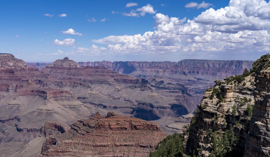 FILE - Clouds pass over the South Rim of Grand Canyon National Park in Grand Canyon Village, Ariz., Aug. 8, 2023. (AP Photo/Alex Brandon, File)