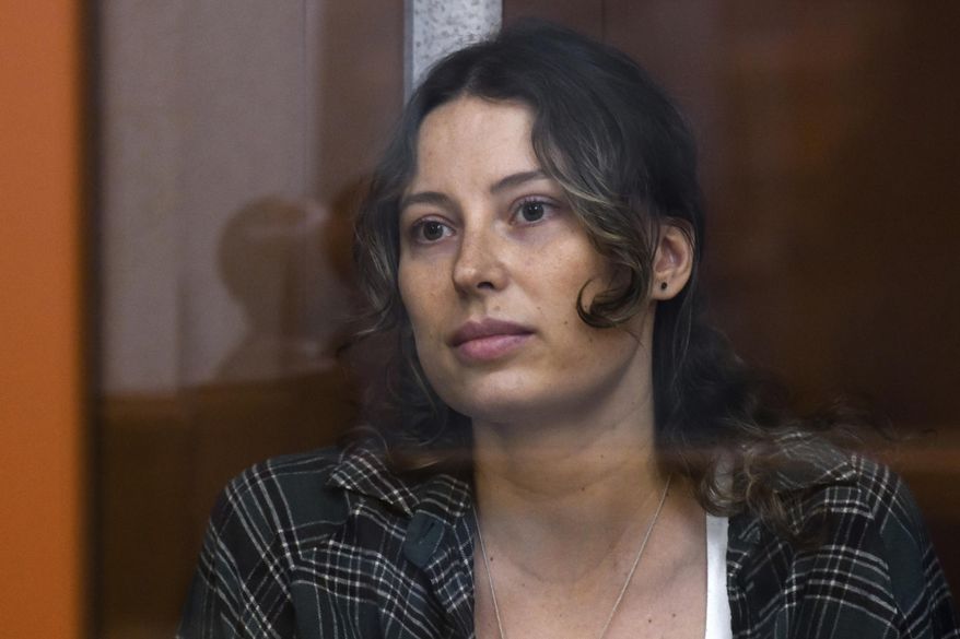 Ksenia Karelina, also known as Khavana, sits in a glass cage in a courtroom in Yekaterinburg, Russia, on Thursday, June 20, 2024. (AP Photo, File)