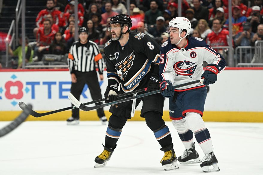 Washington Capitals left wing Alex Ovechkin (8) fighting for position with Columbus Blue Jackets defenseman Dante Fabbro (15) during the first period of an NHL game at Capital One Arena in Washington D.C., April 13, 2025. (Photo for the Washington Times)