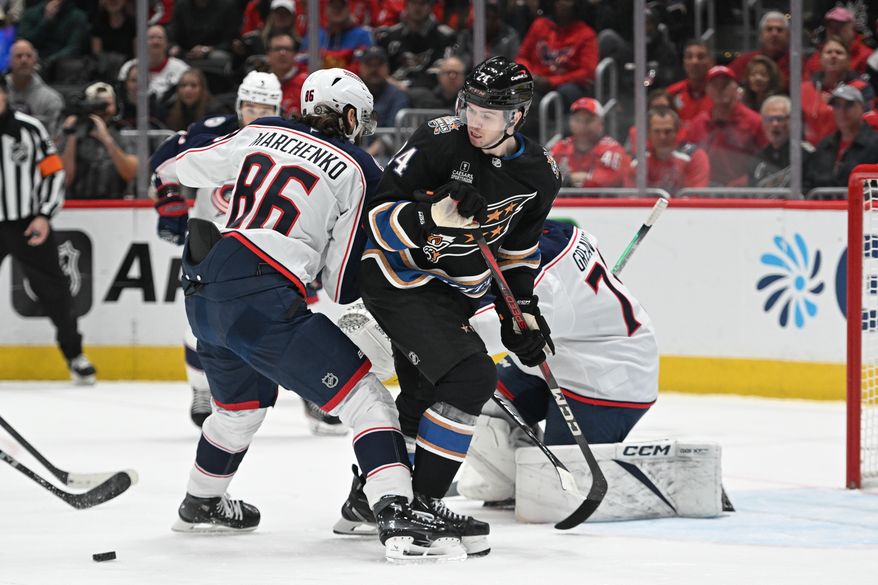 Washington Capitals center Connor McMichael (24) looking back for the puck in front of the net during the first period of an NHL game against the Columbus Blue Jackets at Capital One Arena in Washington D.C., April 13, 2025. (Photo for the Washington Times)