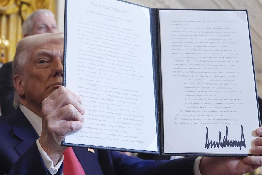 President Donald Trump holds a signed executive order during an event in the East Room of the White House, Tuesday, April 8, 2025, in Washington. (AP Photo/Evan Vucci)