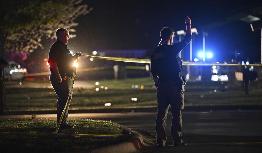 Law enforcement officers work the scene of a shooting Sunday, April 13, 2025 at Fifth Avenue Park in Conway, Ark. (Staci Vandagriff/Arkansas Democrat-Gazette via AP)