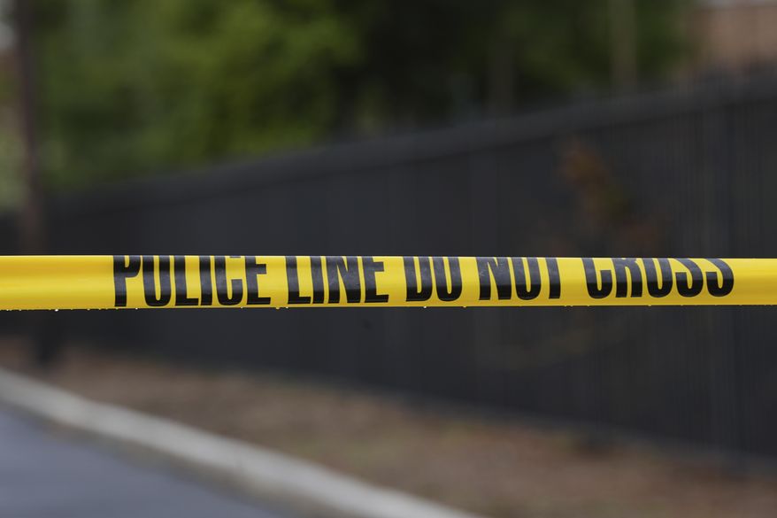 Police tape cordons off an area outside Pennsylvania governor's official residence in Harrisburg, Pa., Monday, April 14, 2025. (AP Photo/Matt Rourke)