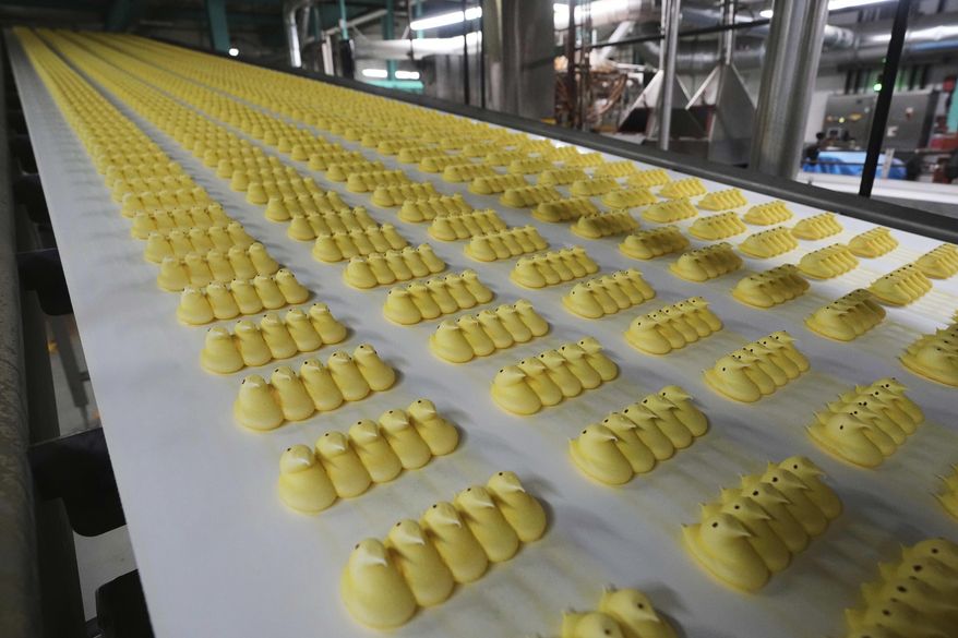 Peeps marshmallow treats move through the manufacturing process at the Just Born factory in Bethlehem, Pa., Thursday, April 10, 2025. (AP Photo/Matt Rourke)