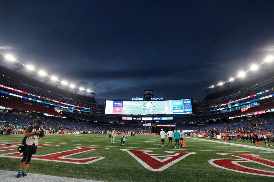 FILE — Lights illuminate Gillette Stadium before an NFL football game between the New England Patriots and the Miami Dolphins, Sept. 17, 2023, in Foxborough, Mass. (AP Photo/Michael Dwyer, File)