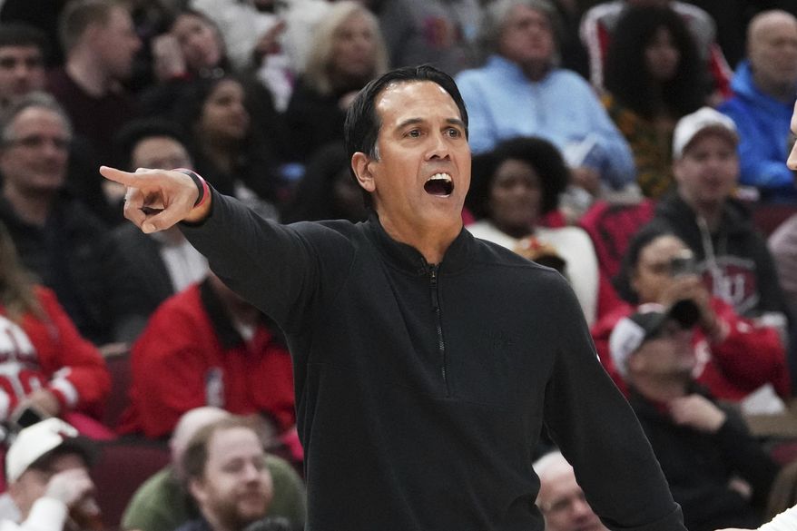 Miami Heat head coach Erik Spoelstra gives direction during the first half of an NBA play-in tournament basketball game against the Chicago Bulls in Chicago, Wednesday, April 16, 2025. (AP Photo/Nam Y. Huh)