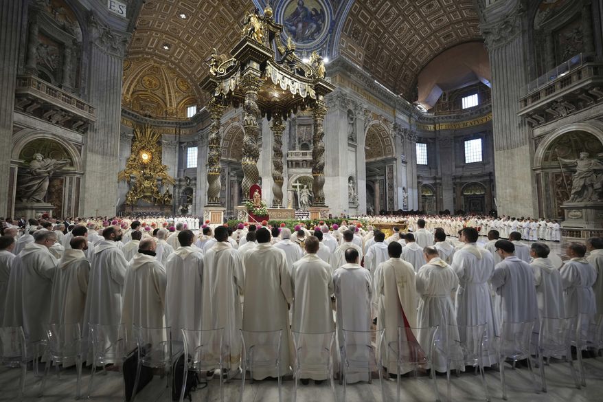 Cardinals attend the Chrism Mass presided over by Delegate of the Holy Father, Cardinal Domenico Calcagno, inside St. Peter's Basilica at The Vatican, Thursday, April. 17, 2022. (AP Photo/Andrew Medichini)