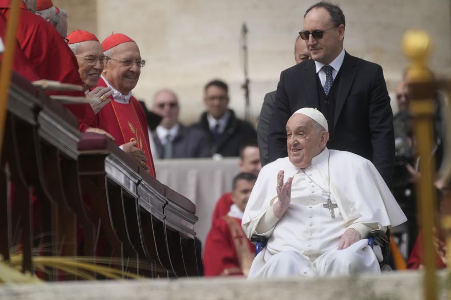 Pope Francis arrives at the end of the mass on Palm Sunday in St. Peter's Square at The Vatican, Sunday, April 13, 2025. (AP Photo/Gregorio Borgia)