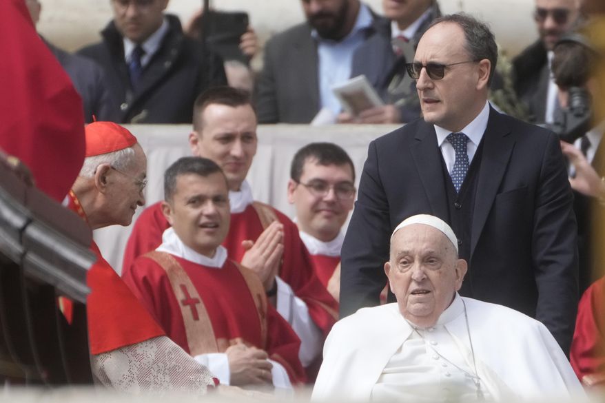 Pope Francis arrives at the end of the mass on Palm Sunday in St. Peter's Square at The Vatican, Sunday, April 13, 2025. (AP Photo/Gregorio Borgia)