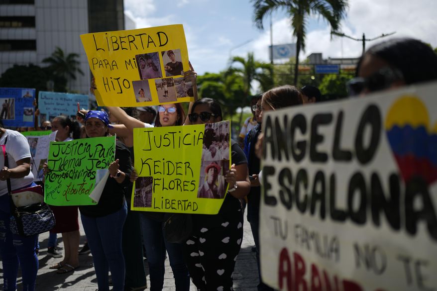 The relatives of Venezuelan migrants in the U.S. who were flown to a prison in El Salvador by the U.S. government who alleged they were members of the Tren de Aragua gang, protest outside of the United Nations building in Caracas, Venezuela, Wednesday, April 9, 2025. (AP Photo/Ariana Cubillos)