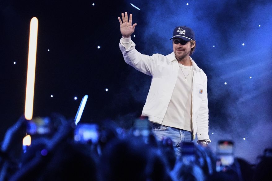 Actor Ryan Gosling waves at audience members during a fan convention called the Star Wars Celebration in Chiba, near Tokyo, Friday, April 18, 2025. (AP Photo/Hiro Komae)