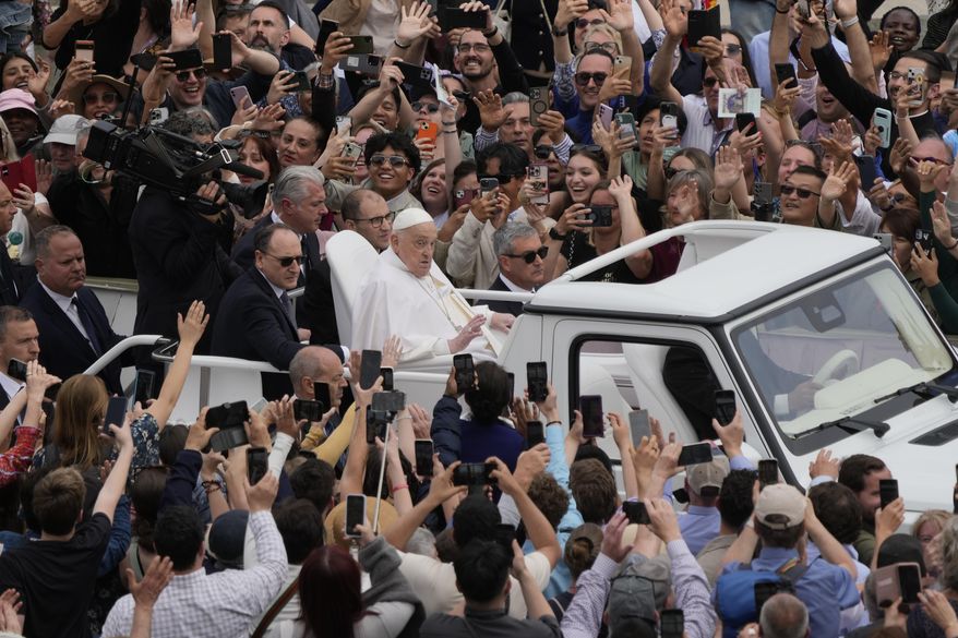 Pope Francis tours St. Peter's Square in his popemobile after bestowing the Urbi et Orbi (Latin for to the city and to the world) blessing at the end of the Easter mass presided over by Cardinal Angelo Comastri in St. Peter's Square at the Vatican Sunday, April 20, 2025.(AP Photo/Gregorio Borgia)