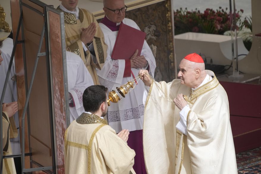 Cardinal Angelo Comastri presides over the Easter mass in St. Peter's Square at the Vatican Sunday, April 20, 2025. (AP Photo/Gregorio Borgia)