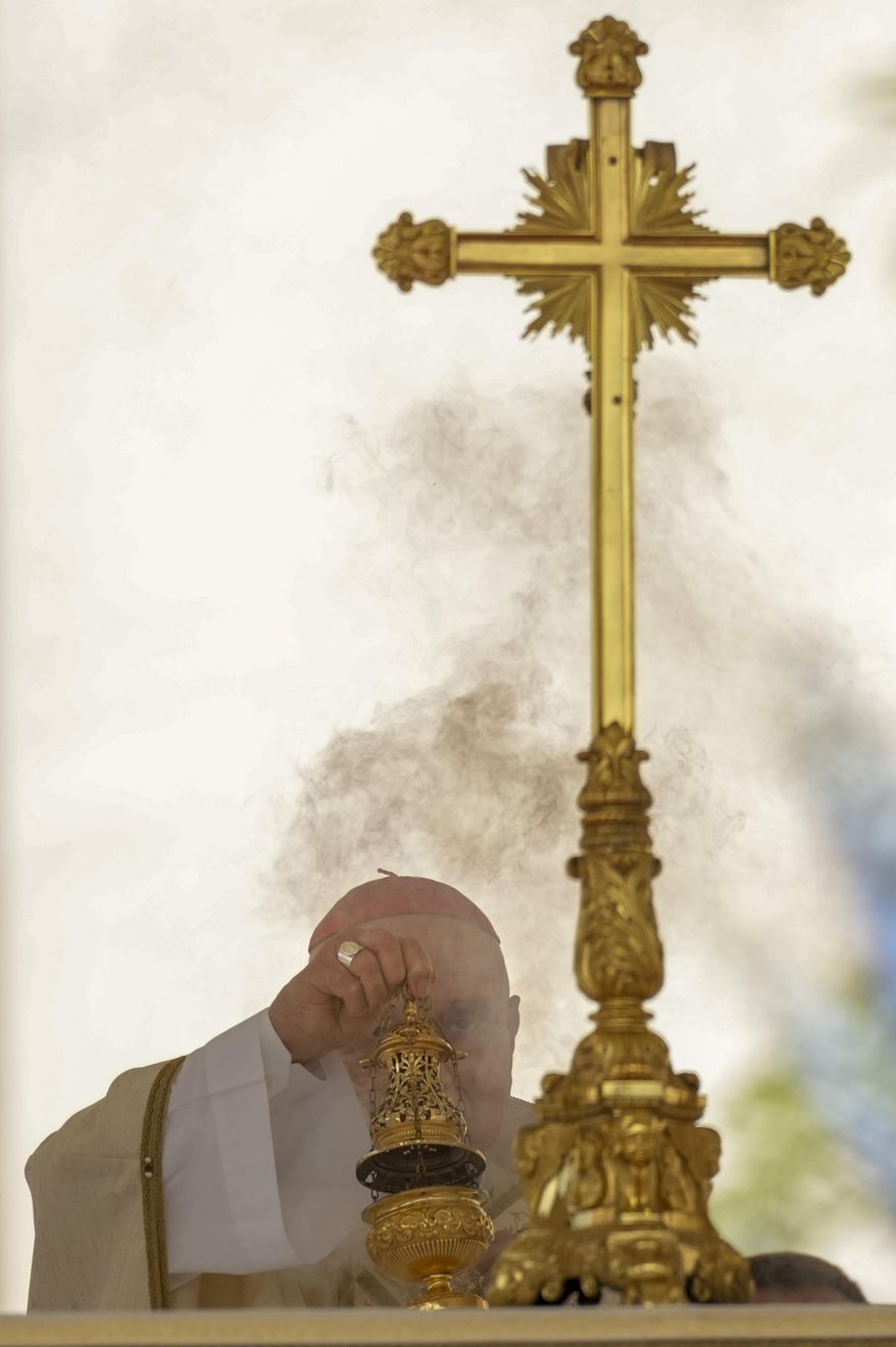 Cardinal Angelo Comastri presides over the Easter mass in St. Peter's Square at the Vatican Sunday, April 20, 2025. (AP Photo/Andrew Medichini)