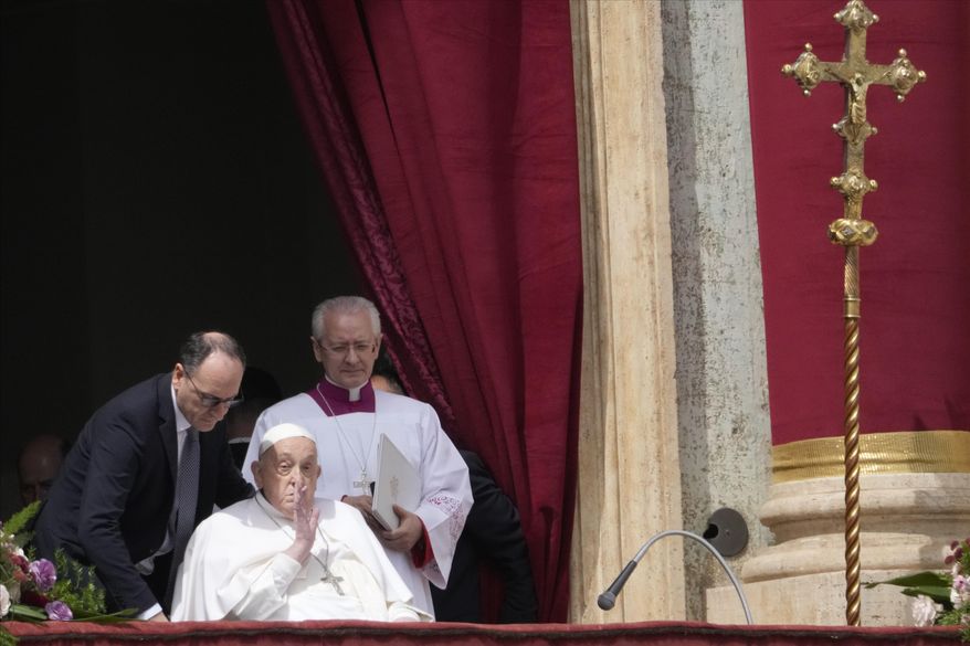 Pope Francis bestows the Urbi et Orbi (Latin for to the city and to the world) blessing from the central lodge of St. Peter's Basilica at the end of the Easter mass presided over by Cardinal Angelo Comastri in St. Peter's Square at the Vatican Sunday, April 20, 2025. (AP Photo/Gregorio Borgia)