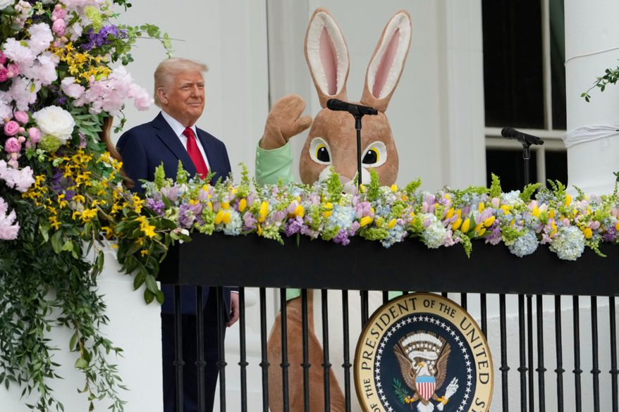 President Donald Trump arrives on the Blue Room Balcony to participate in the White House Easter Egg Roll Monday, April 21, 2025, in Washington. (AP Photo/Alex Brandon)