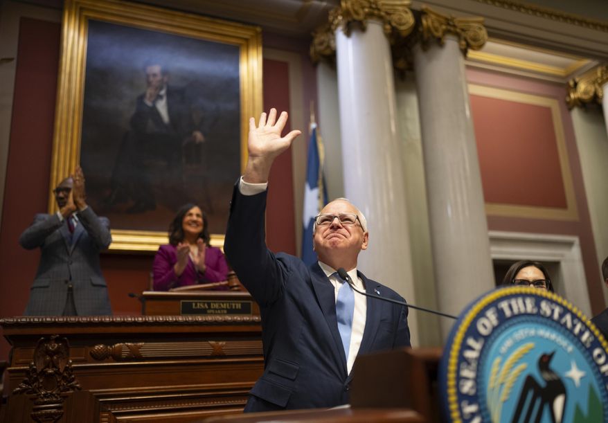 Minnesota Gov. Tim Walz acknowledges the applause of the House chamber before he delivers his State of the State address before a joint session of the Legislature at the state Capitol in St. Paul, Minn., Wednesday, April 23, 2025. (Jeff Wheeler/Star Tribune via AP)