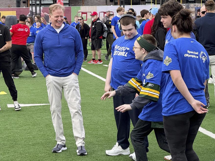 NFL Commissioner Roger Goodell encourages athletes from the Special Olympics at the league’s flag football clinic outside Lambeau Field, Wednesday, April 23, 2025, in Green Bay, Wis. (AP Photo/Rob Maaddi)