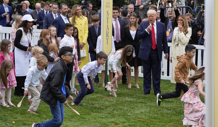 President Donald Trump and first lady Melania Trump watch as children participate durng the White House Easter Egg Roll on the South Lawn of the White House, Monday, April 21, 2025, in Washington. (AP Photo/Alex Brandon)