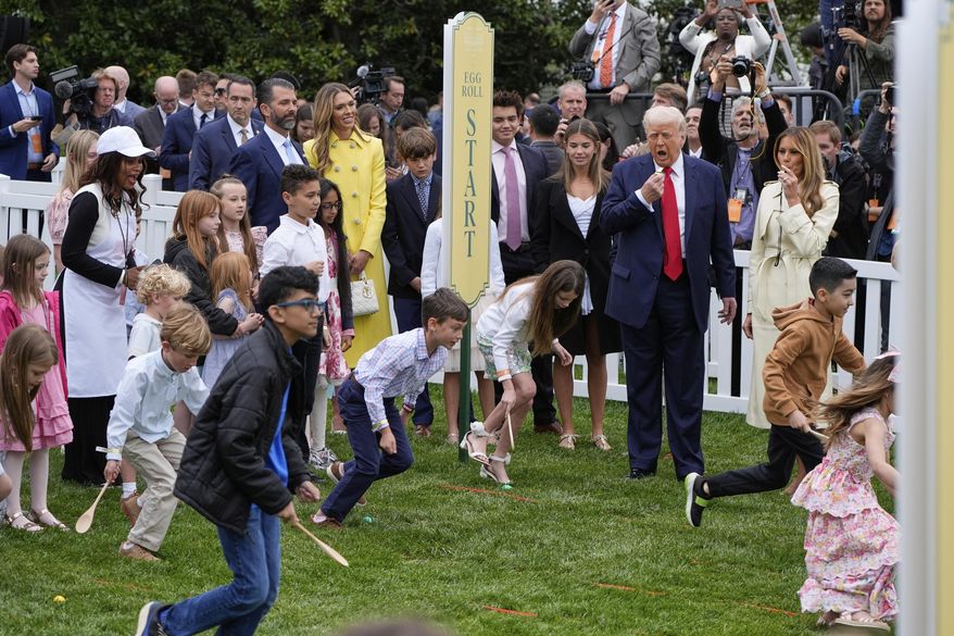 President Donald Trump and first lady Melania Trump watch as children participate durng the White House Easter Egg Roll on the South Lawn of the White House, Monday, April 21, 2025, in Washington. (AP Photo/Alex Brandon)