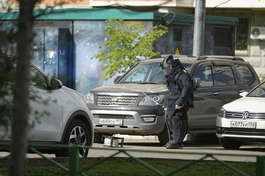 A sapper works at the scene where Lt. Gen. Yaroslav Moskalik, a deputy head of the main operational department in the General Staff of the Russian armed forces, was killed by an explosive device placed in a car in Balashikha, just outside Moscow, Russia, on Friday, April 25, 2025. (AP Photo)