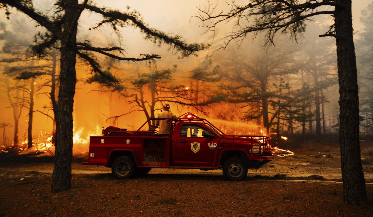 NextImg:Forecasters warn of fire risk amid low humidity, wind gusts as Pine Barrens fire burns