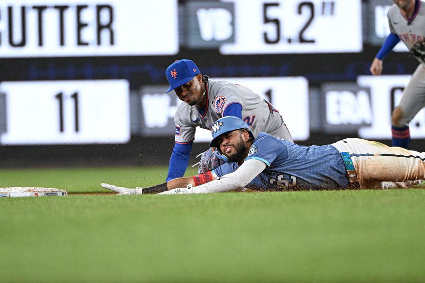 New York Mets shortstop Francisco Lindor (12) putting the tag on Washington Nationals second baseman Luis Garcia (2) after trying to stretch a single into a double during the eighth inning of an MLB game against the New York Mets at Nationals Park in Washington D.C., April 25, 2025. (Photo by All-Pro Reels for Washington Times Sports)