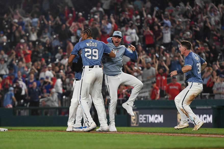 Washington Nationals designated hitter James Wood (29) being greeted by teammates after hitting the game-winning single during the ninth inning of an MLB game against the New York Mets at Nationals Park in Washington D.C., April 25, 2025. (Photo by All-Pro Reels for Washington Times Sports)
