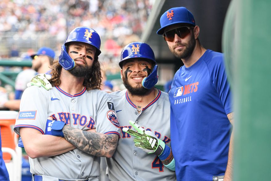 New York Mets catcher Francisco Alvarez (4) (center) posing with teammates Jesse Winker (3) (left) and David Peterson (23) after hitting a homerun during the second inning of an MLB game against the Washington Nationals at Nationals Park in Washington D.C., April 26, 2025. (Photo by All-Pro Reels for Washington Times Sports)