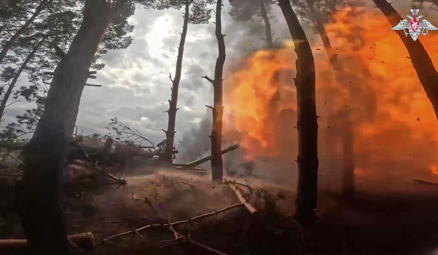 In this photo taken from video distributed by Russian Defense Ministry Press Service on Sunday, April 27, 2025, a Russian Army 152mm howitzer Giatsint-B fires towards Ukrainian positions in Kherson, Ukraine. (Russian Defense Ministry Press Service via AP)