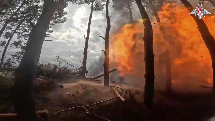 In this photo taken from video distributed by Russian Defense Ministry Press Service on Sunday, April 27, 2025, a Russian Army 152mm howitzer Giatsint-B fires towards Ukrainian positions in Kherson, Ukraine. (Russian Defense Ministry Press Service via AP)