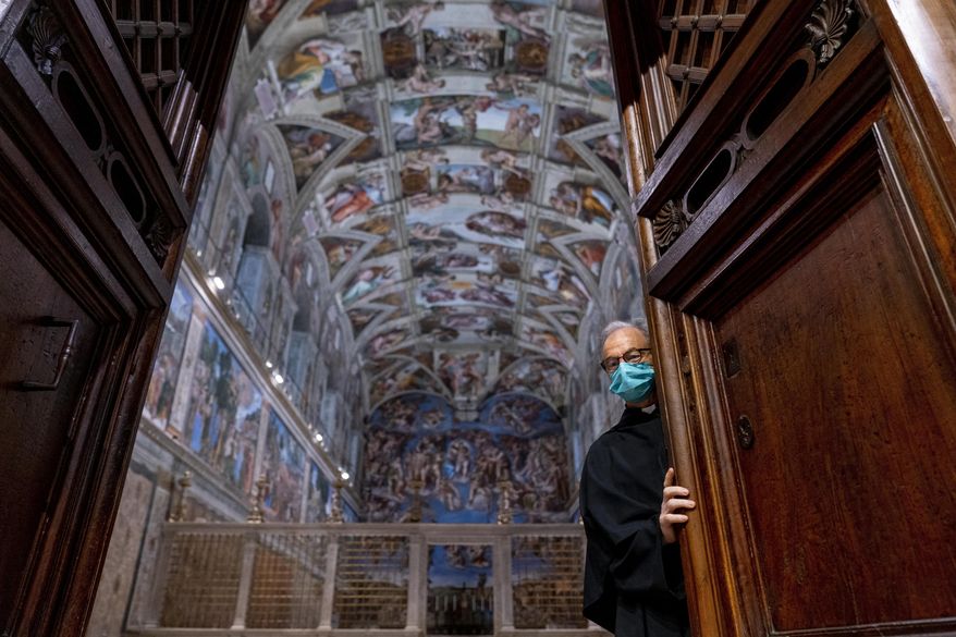 Custodian of the Apostolic Shrine Padre Bruno Silvestrini closes the doors to the Sistine Chapel at the Vatican in Rome, June 28, 2021. (AP Photo/Andrew Harnik, Pool)