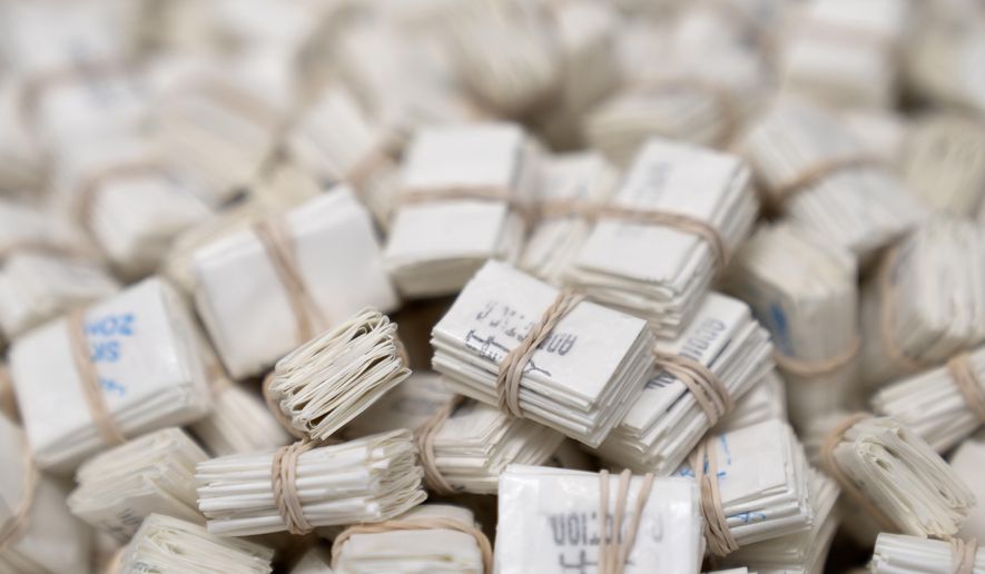 Glassine envelopes used to package fentanyl pills or fentanyl powder are displayed at a Drug Enforcement Administration (DEA) research laboratory on Tuesday, April 29, 2025, in Northern Virginia. (AP Photo/Mark Schiefelbein) **FILE**