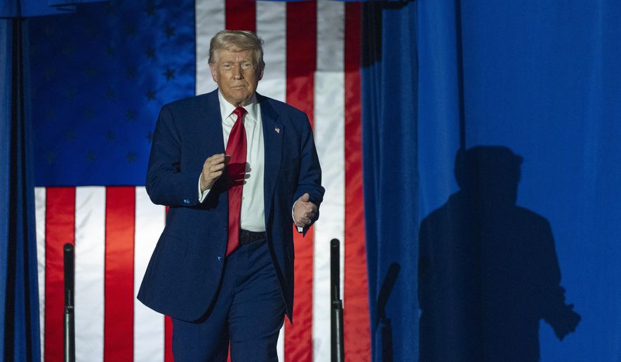 President Donald Trump arrives to speak on his first 100 days at Macomb County Community College Sports Expo Center, Tuesday, April 29, 2025, in Warren, Mich. (AP Photo/Alex Brandon)