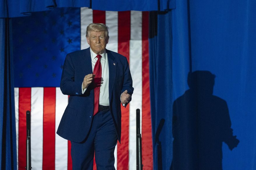 President Donald Trump arrives to speak on his first 100 days at Macomb County Community College Sports Expo Center, Tuesday, April 29, 2025, in Warren, Mich. (AP Photo/Alex Brandon)