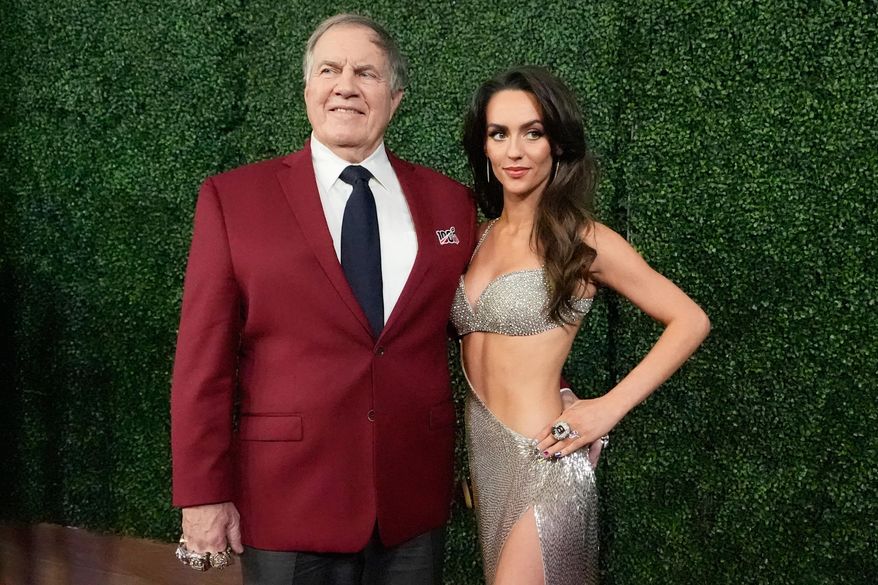 Former NFL head coach Bill Belichick and girlfriend Jordon Hudson, pose on the red carpet at the NFL Honors award show ahead of the Super Bowl 59 football game, Thursday, Feb. 6, 2025, in New Orleans. (AP Photo/Brynn Anderson, File)